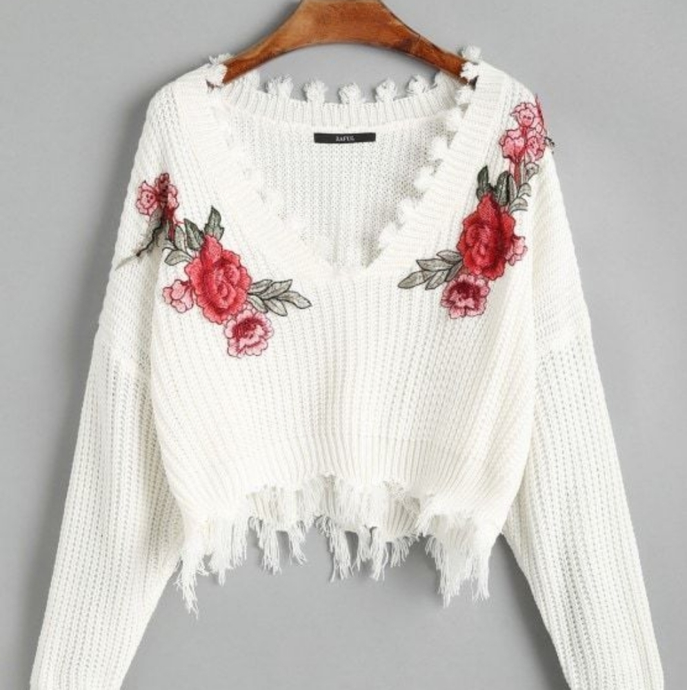 A never worn before cropped sweater